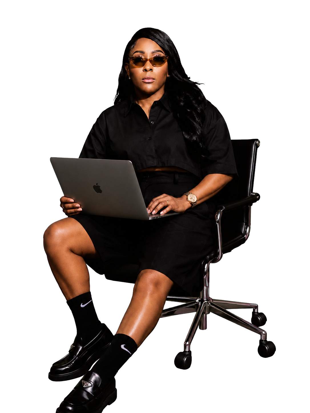 Meshia Hicks seated with her laptop